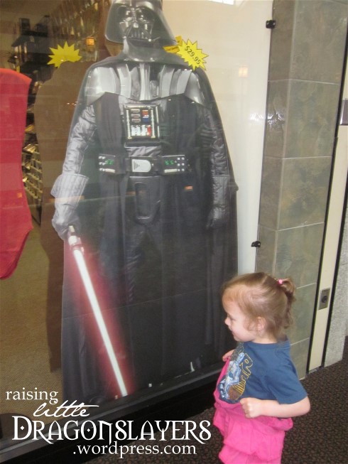 Dancing with Darth Vader?  Flashing him?  I'm not quite sure.