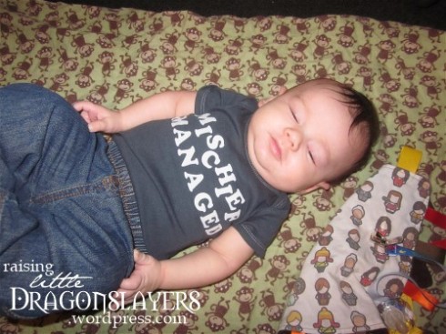 Managing that mischief, hanging out in line in his "Harry Potter" onesie.